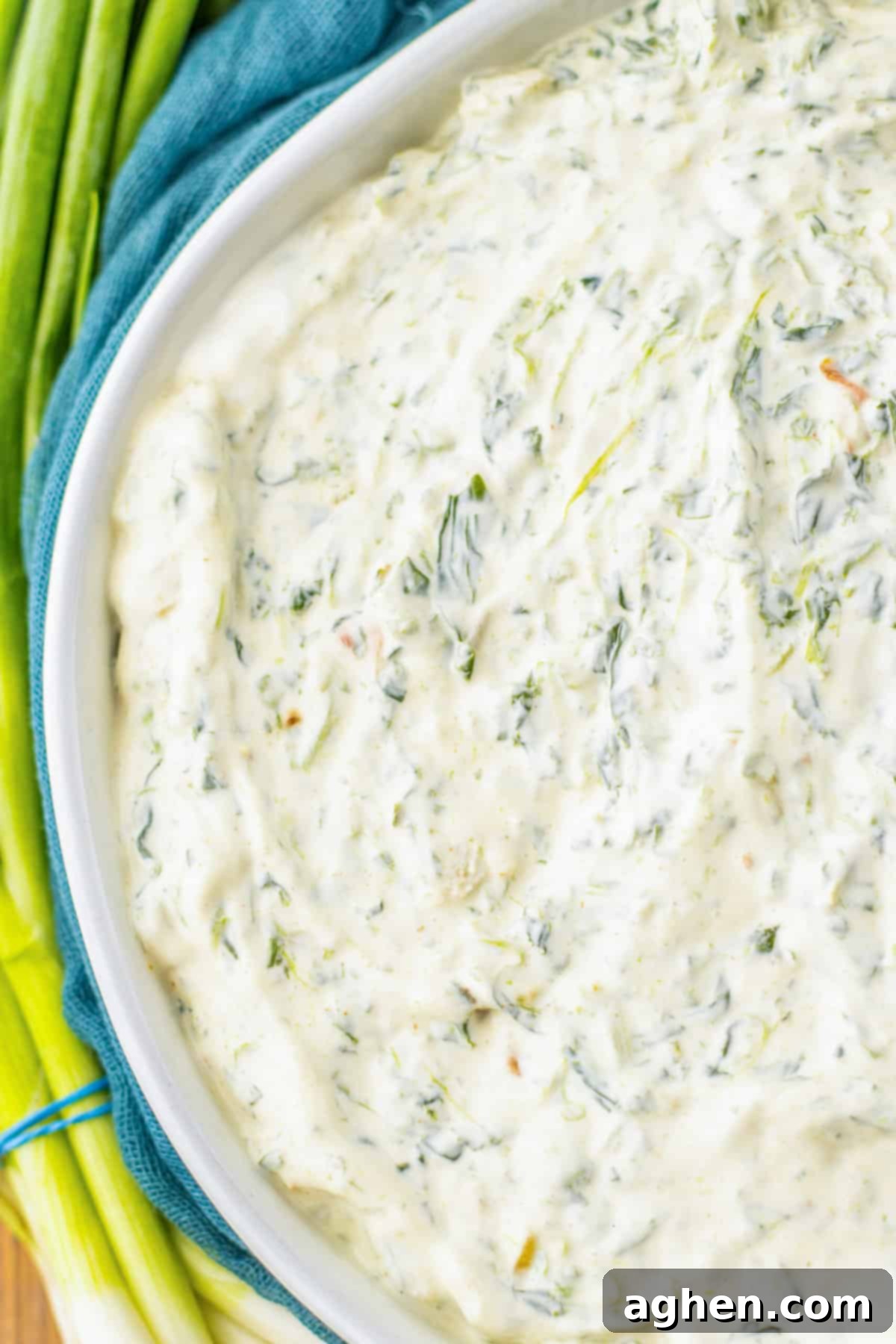 Creamy Knorr Spinach Dip 7 Close-up shot of Knorr vegetable mix spinach dip showing its creamy texture and visible water chestnuts, inviting a taste.