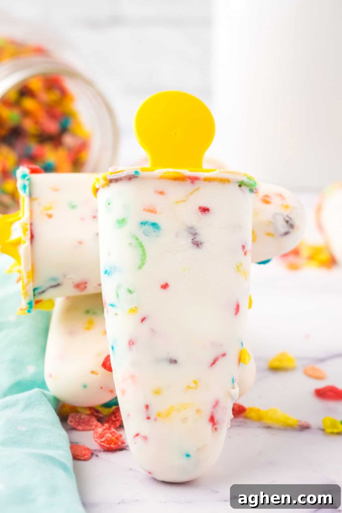 Fruity Pebbles Cereal Popsicles made with Greek Yogurt, a healthy and fun treat.