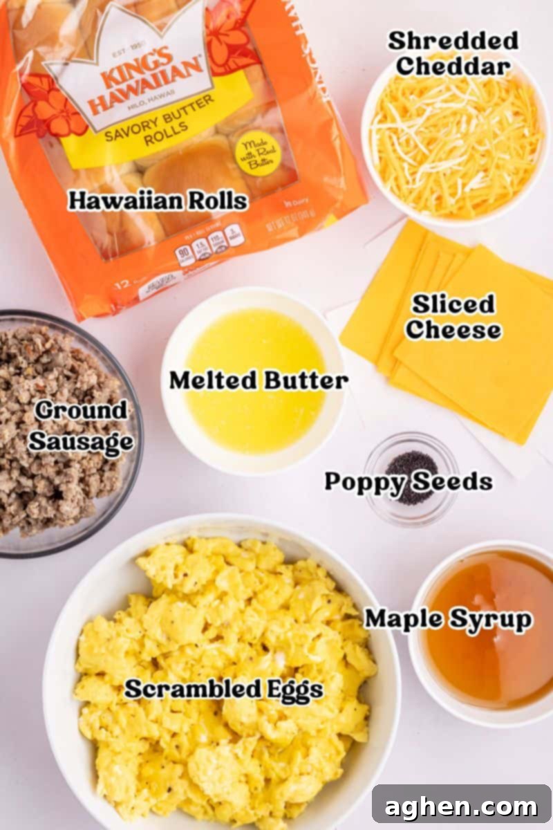 Sweet & Savory Hawaiian Breakfast Bake 4 A vibrant flat lay showcasing all the essential ingredients for Hawaiian Roll Breakfast Sliders: King's Hawaiian rolls, various cheeses, ground breakfast sausage, scrambled eggs, pure maple syrup, melted butter, and poppy seeds laid out for preparation.