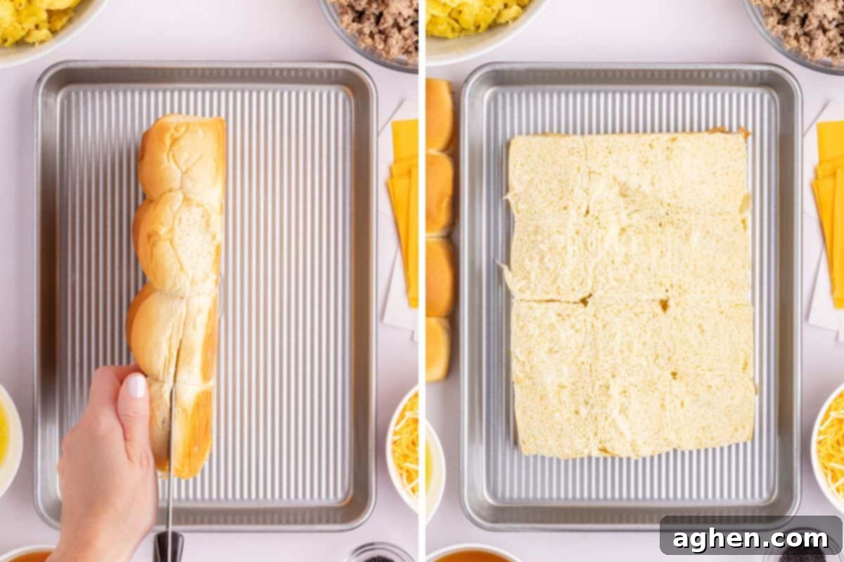 Sweet & Savory Hawaiian Breakfast Bake 5 On the left, a sheet of Hawaiian slider buns is being sliced horizontally to perfectly separate the bottoms from the tops, demonstrating a key preparation step. On the right, the bottom halves of the slider buns are neatly arranged on a metal baking sheet, ready for the layers of delicious fillings.