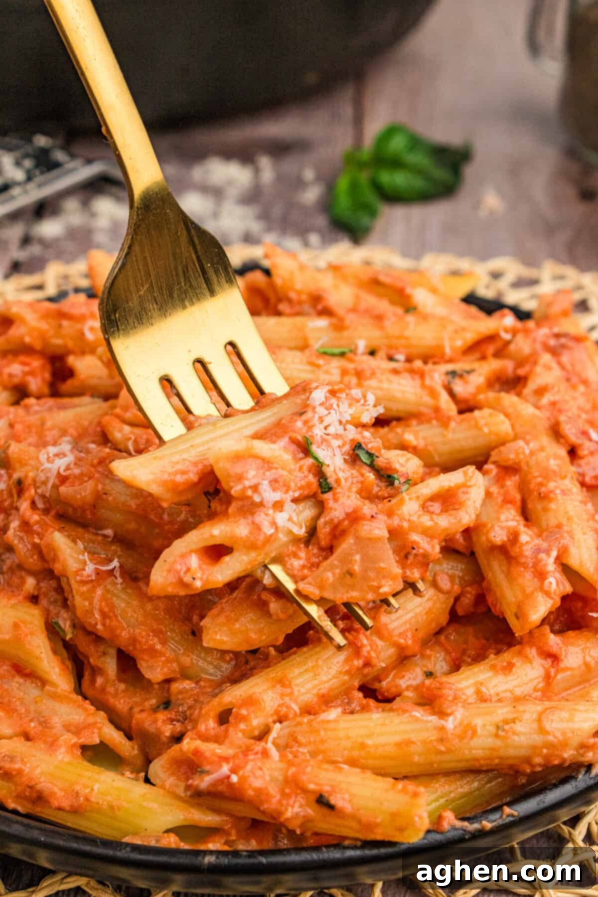 Forkfull of pasta with vodka sauce.