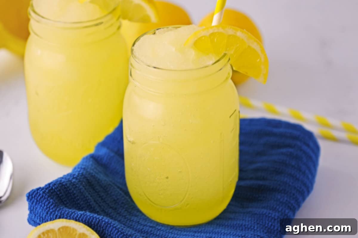 Frozen Lemonade Bliss 6 Lemonade slushy made with fresh lemon and served in a mason jar.