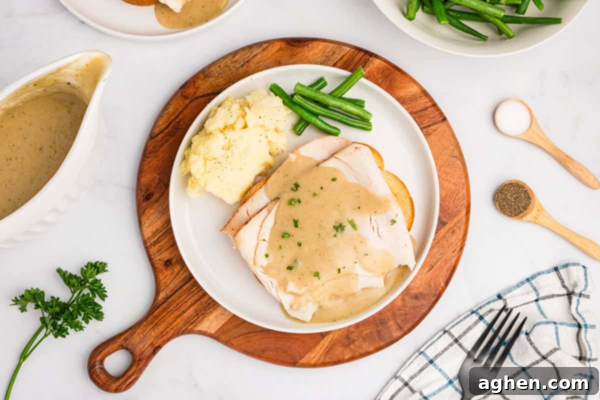 Open Faced Turkey Sandwich 3 Hot open faced turkey sandwich made with deli-sliced turkey, topped with gravy and garnished with fresh parsley on toasted bread.
