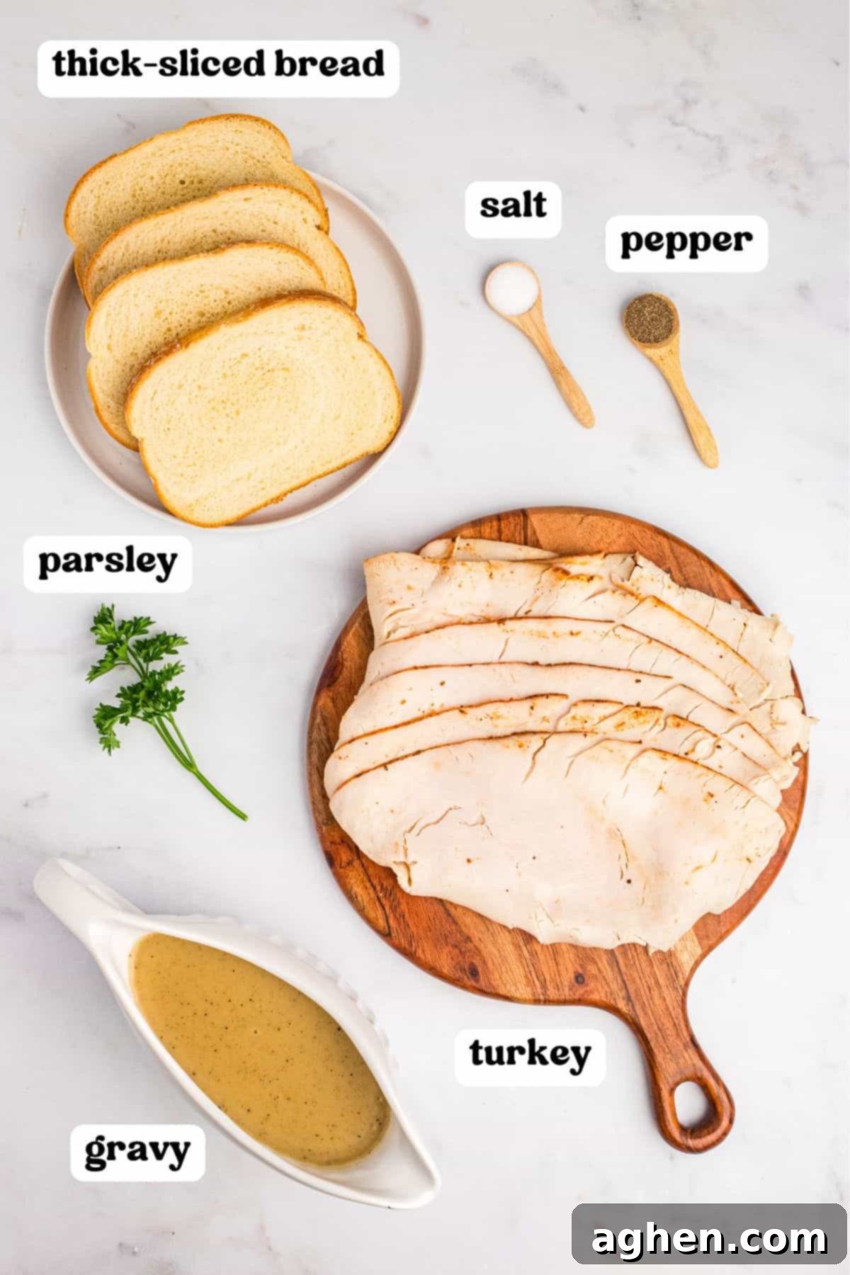 Open Faced Turkey Sandwich 4 Ingredients for open faced turkey sandwich, including sliced turkey, thick bread, gravy, salt, pepper, and fresh parsley.