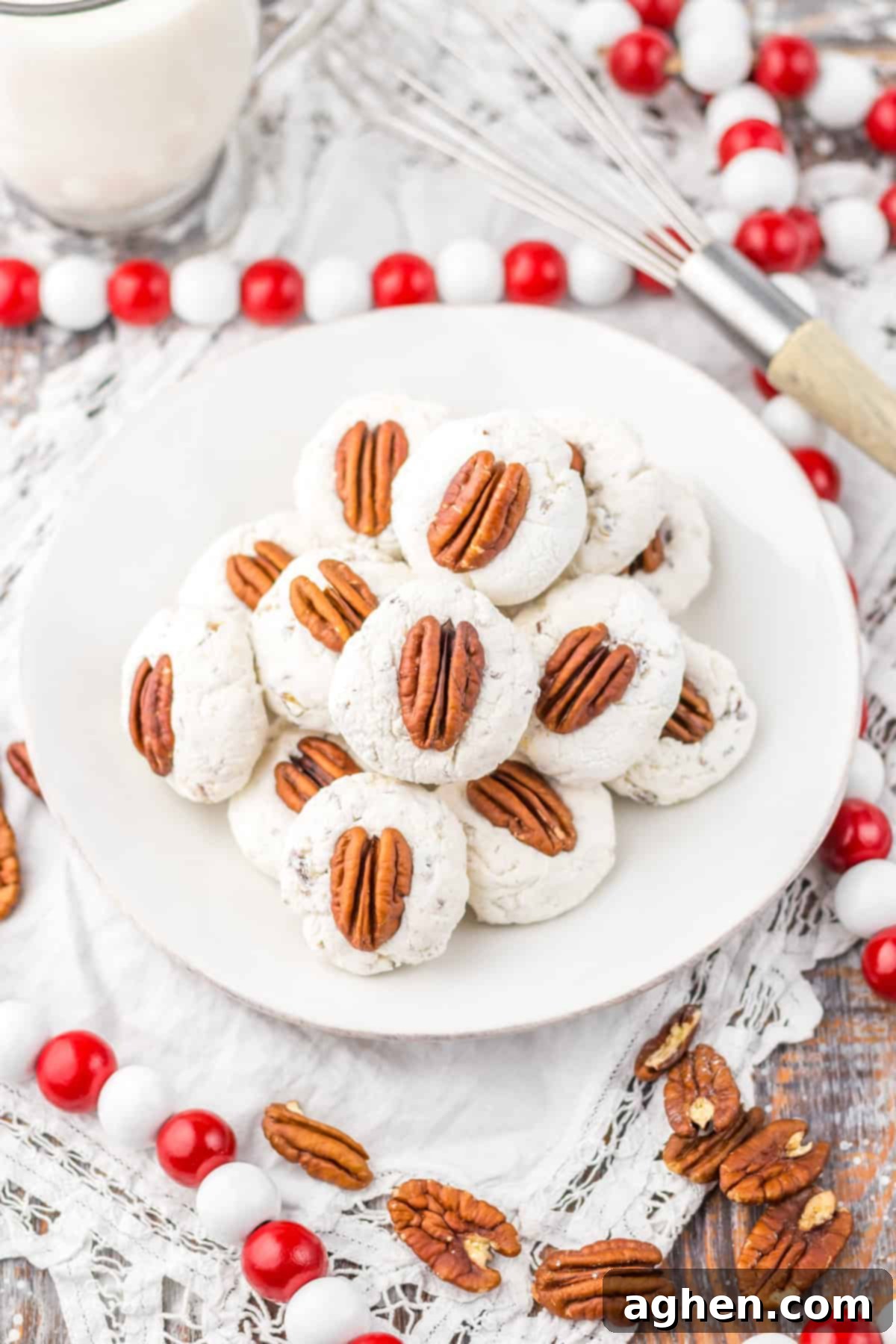 Plate filled with classic divinity candy cookies topped with pecans, perfect for holiday desserts or edible gifting.