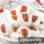 Plate of classic divinity cookies topped with pecans.
