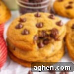 Bake Mrs Fields Legendary Chocolate Chip Cookies 11 A stack of copycat Mrs. Fields chocolate chip cookies with one cookie bitten to reveal the gooey chocolate chips inside.