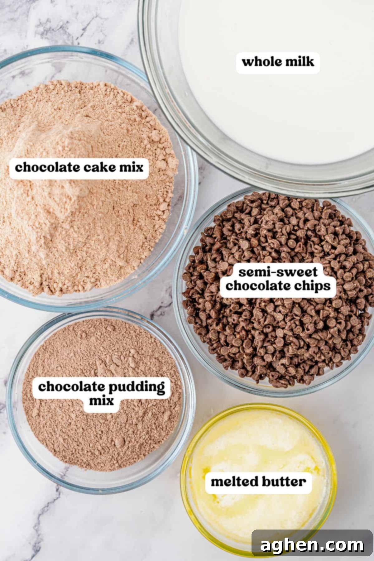 Effortless Chocolate Indulgence 4 Ingredients for chocolate dump cake in 5 clear glass bowls, each labeled with its contents: whole milk, chocolate cake mix, semi-sweet chocolate chips, chocolate pudding mix, and melted butter.