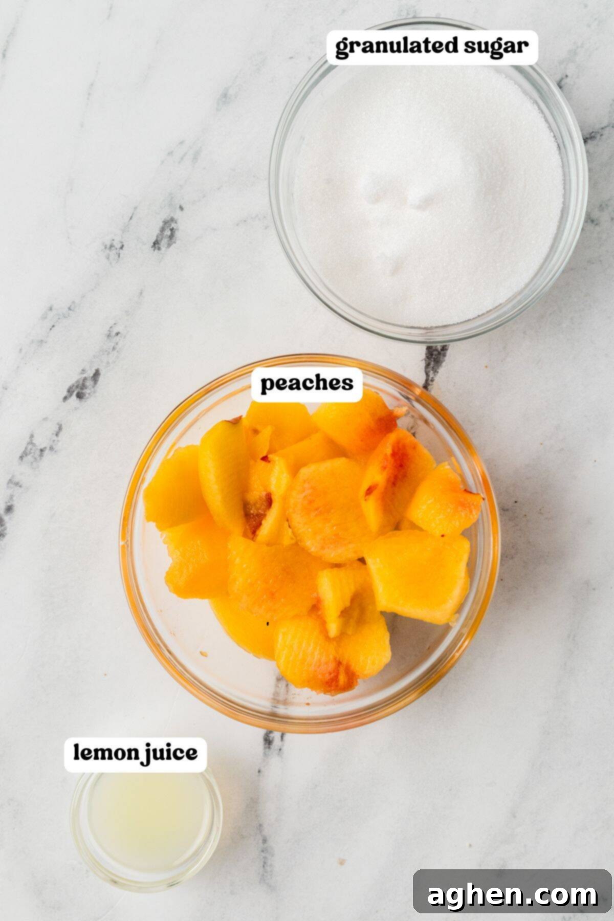 Three labeled bowls containing chopped peaches, granulated sugar, and lemon juice. Essential ingredients for no-pectin peach jam.