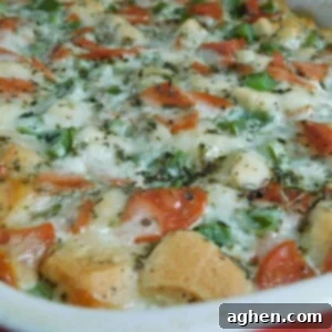 Breakfast Pizza Casserole with golden biscuits and melted cheese