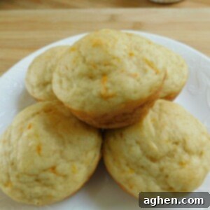 Glazed Orange Yogurt Muffins 2 Close-up of a stack of orange glazed yogurt muffins