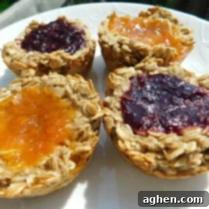 A featured image of a delicious raspberry jam muffin, showing its rustic top and a glimpse of the fruit filling.