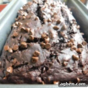 Decadent Double Chocolate Banana Bread 8 A delicious slice of Double Chocolate Banana Bread, moist and ready to eat.