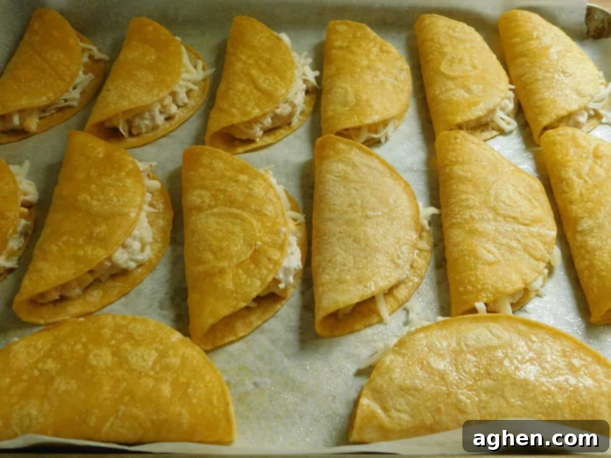 Assembled white chicken chili tacos ready for baking