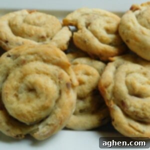 Garlic Parmesan Bacon Pinwheels 2 A close-up of a single baked Garlic Parmesan Bacon Wheel.