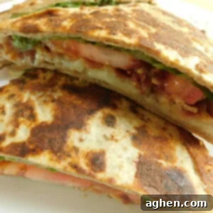 Close-up of a delicious BLT and cheese french toast sandwich made with Flatout bread, golden brown and perfectly folded.