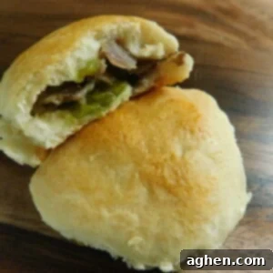 philly cheesesteak biscuit bites on wooden cutting board