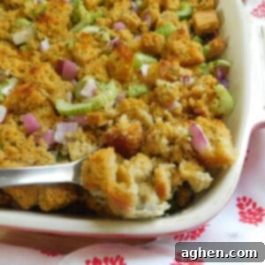 A square image of the golden-brown cornbread stuffing, highlighting its texture and color.