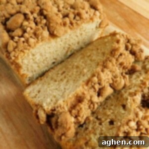 Golden Crumb Banana Bread 2 banana bread with crumble topping sliced on cutting board