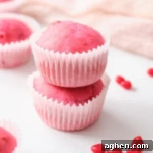 Candied Cherry Muffin Delights 2 weight watchers cherry muffins on white cutting board