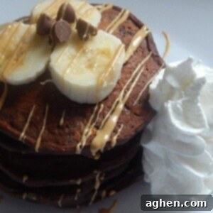Decadent Double Chocolate Peanut Butter Banana Pancakes 2 Double Chocolate Peanut Butter Banana Pancakes served with a side of fruit