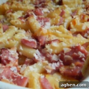 Island Paradise Pasta Bake 3 Top view of the baked Hawaiian pasta casserole, showing melted cheese and toasted coconut flakes