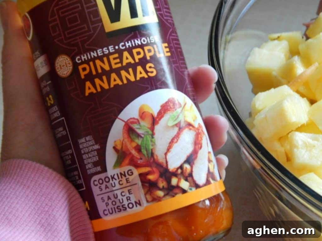 Island Paradise Pasta Bake 4 Close-up of the diced ham and fresh pineapple, mixed with cooked penne pasta, forming the base of the casserole.