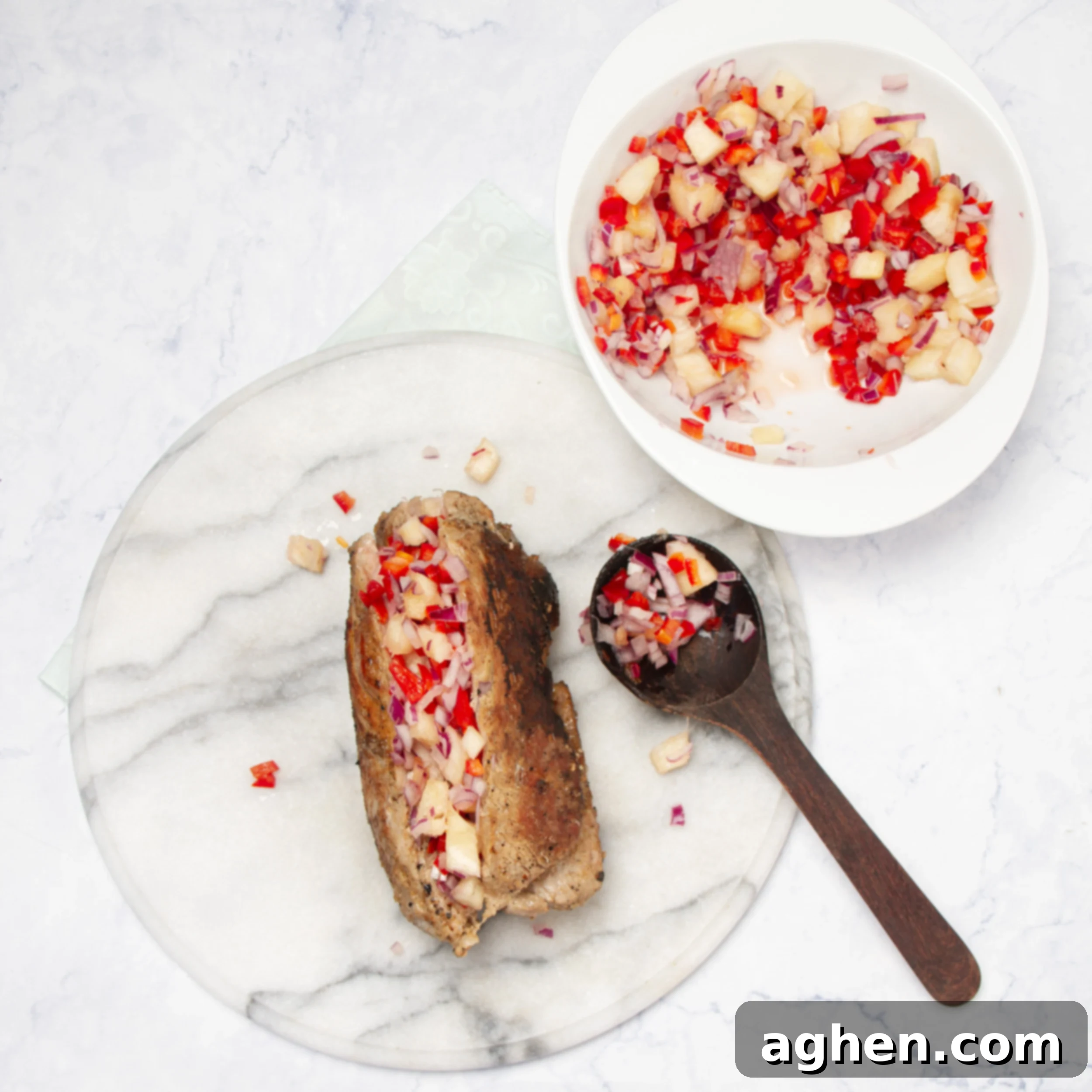 Pineapple Salsa Pork Tenderloin Feast 7 Pork tenderloin topped with pineapple salsa.