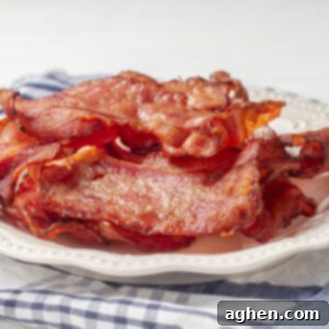 Perfectly Crispy Air Fryer Turkey Bacon 3 Crispy air fryer turkey bacon on a plate.