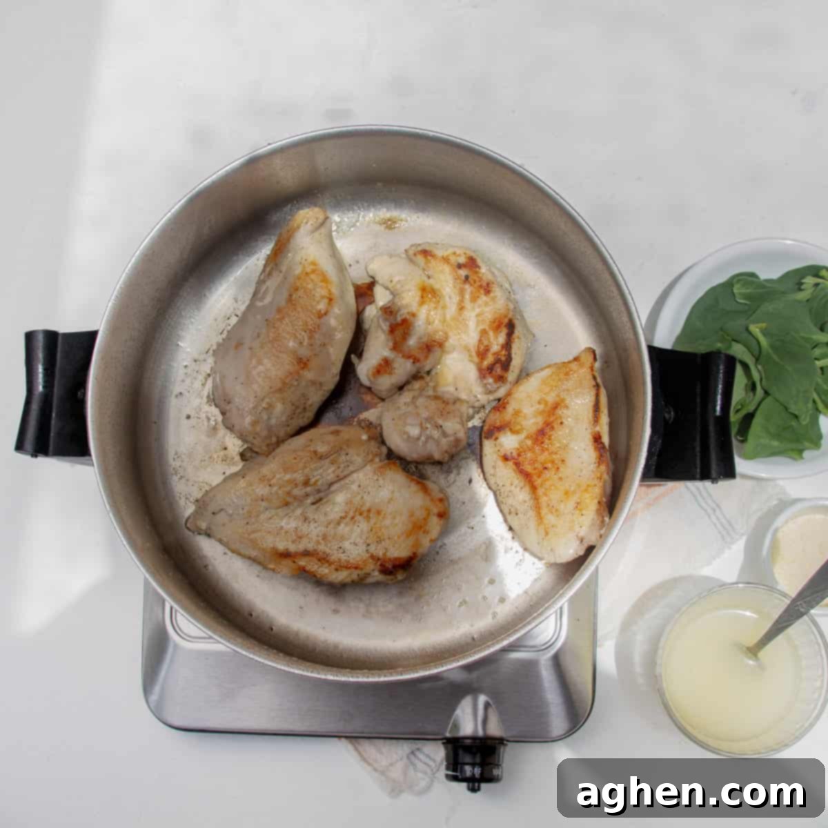 Luscious Light Chicken Florentine 4 Chicken cooking in a hot pan, sizzling and browning.