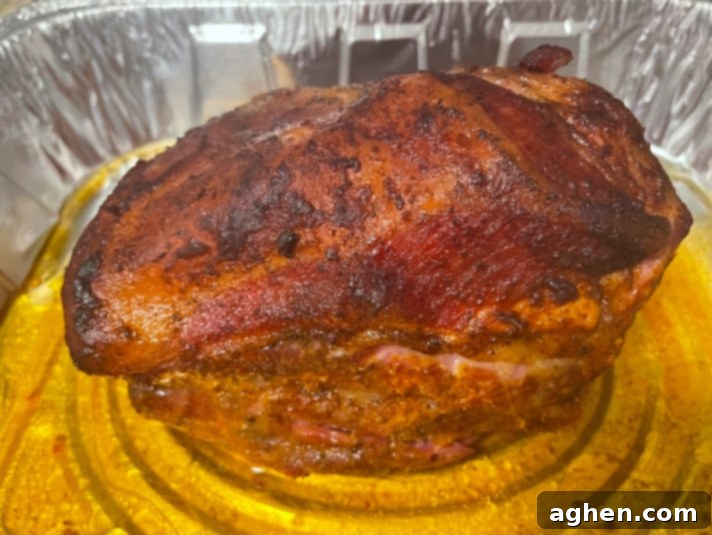 The Chef's Blueprint: 10 Skills for Big Green Egg Mastery 4 smoked pulled pork in a foil pan