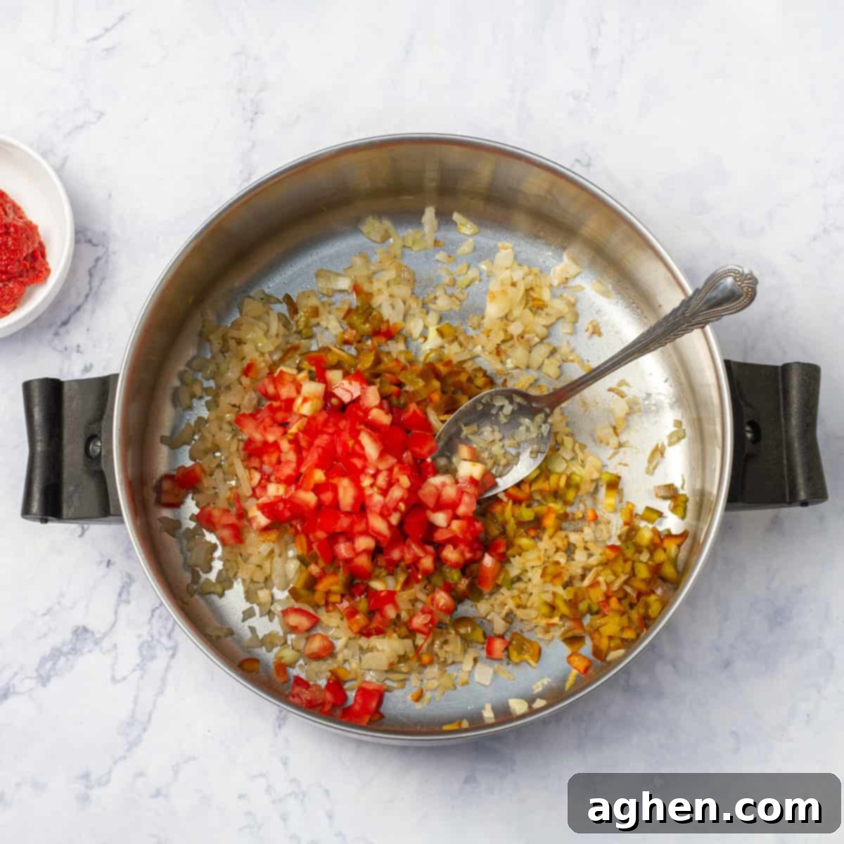 Quick-Fix Stuffed Pepper Casserole 4 Aromatic ingredients cooking in a hot pan.