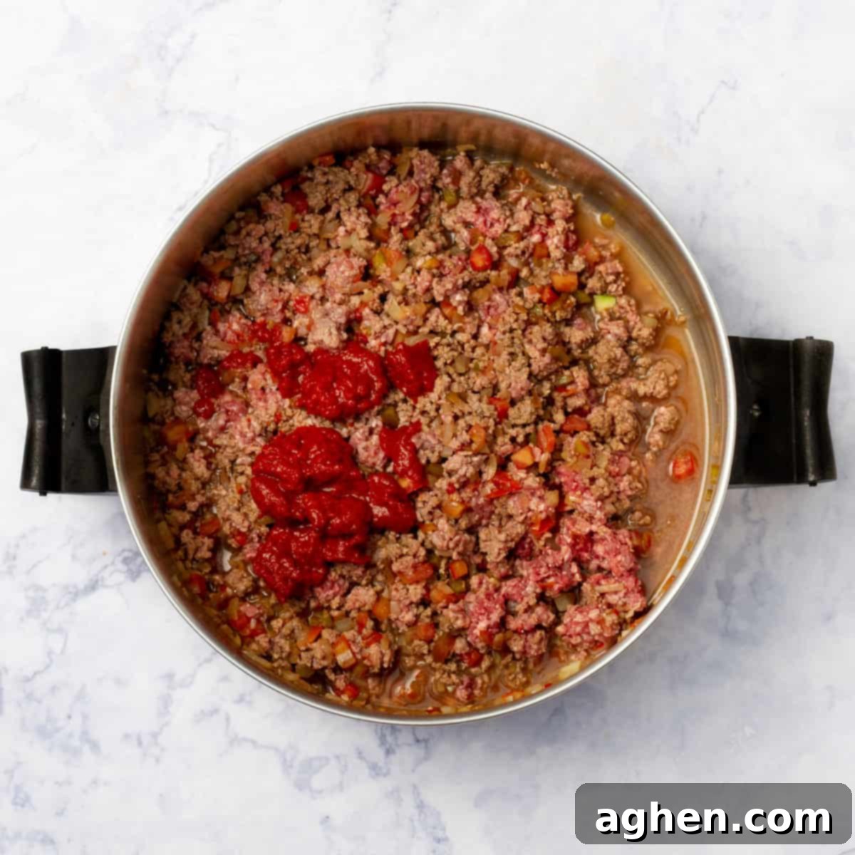 Quick-Fix Stuffed Pepper Casserole 5 Ground beef added to the cooked aromatics and vegetables in a hot pan.
