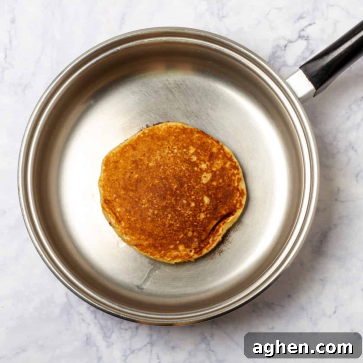 Smart Apple Pancakes 5 An apple pancake cooking in a hot pan.