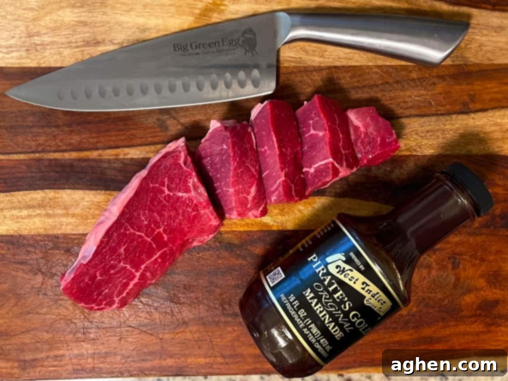 12 Steps to Mastering Your Big Green Egg's Ultimate Accessory 4 steak on a cutting board