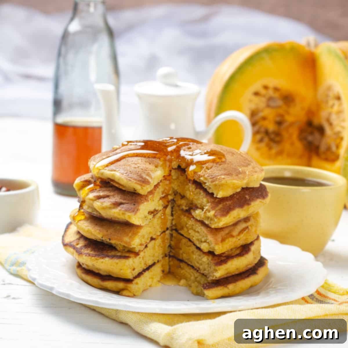 Fall Mornings Deserve These Irresistible Pumpkin Pancakes 7 A beautiful stack of healthy pumpkin pancakes drizzled generously with honey or maple syrup, showcasing their fluffy texture and golden-brown perfection.