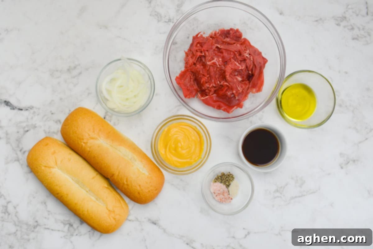 Make The Perfect Blackstone Philly Cheesesteak Every Time 3 Ingredients for Blackstone Philly Cheesesteaks laid out on a table.