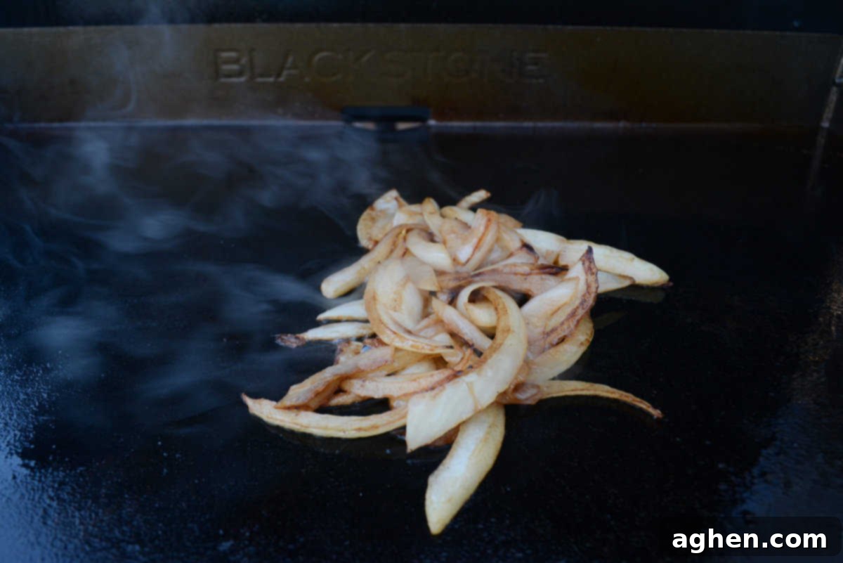 The Ultimate Blackstone Smash Burgers 5 caramelized onions on the blackstone