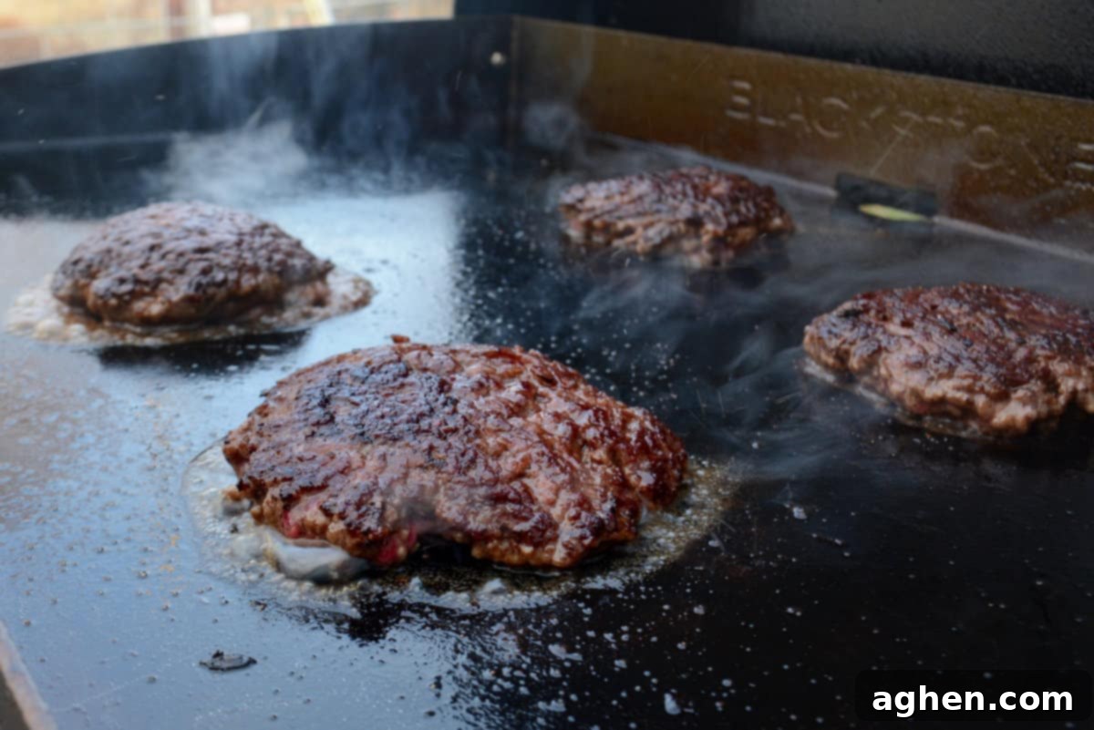 The Ultimate Blackstone Smash Burgers 9 flipped smash burger patties on blackstone