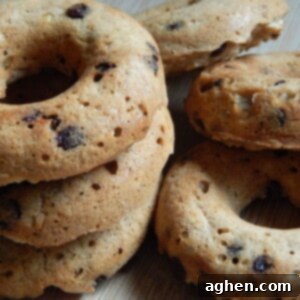 Oatmeal Chocolate Chip Donuts: A Wholesome Indulgence 2 A stack of three oatmeal chocolate chip donuts on a white plate
