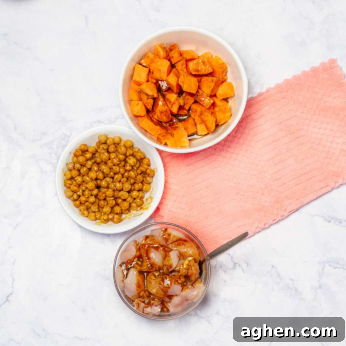 Weight Watchers Guide to Crafting the Ultimate Buddha Bowl 5 A bowl containing chicken cubes, chickpeas, and diced sweet potatoes marinating in dressing