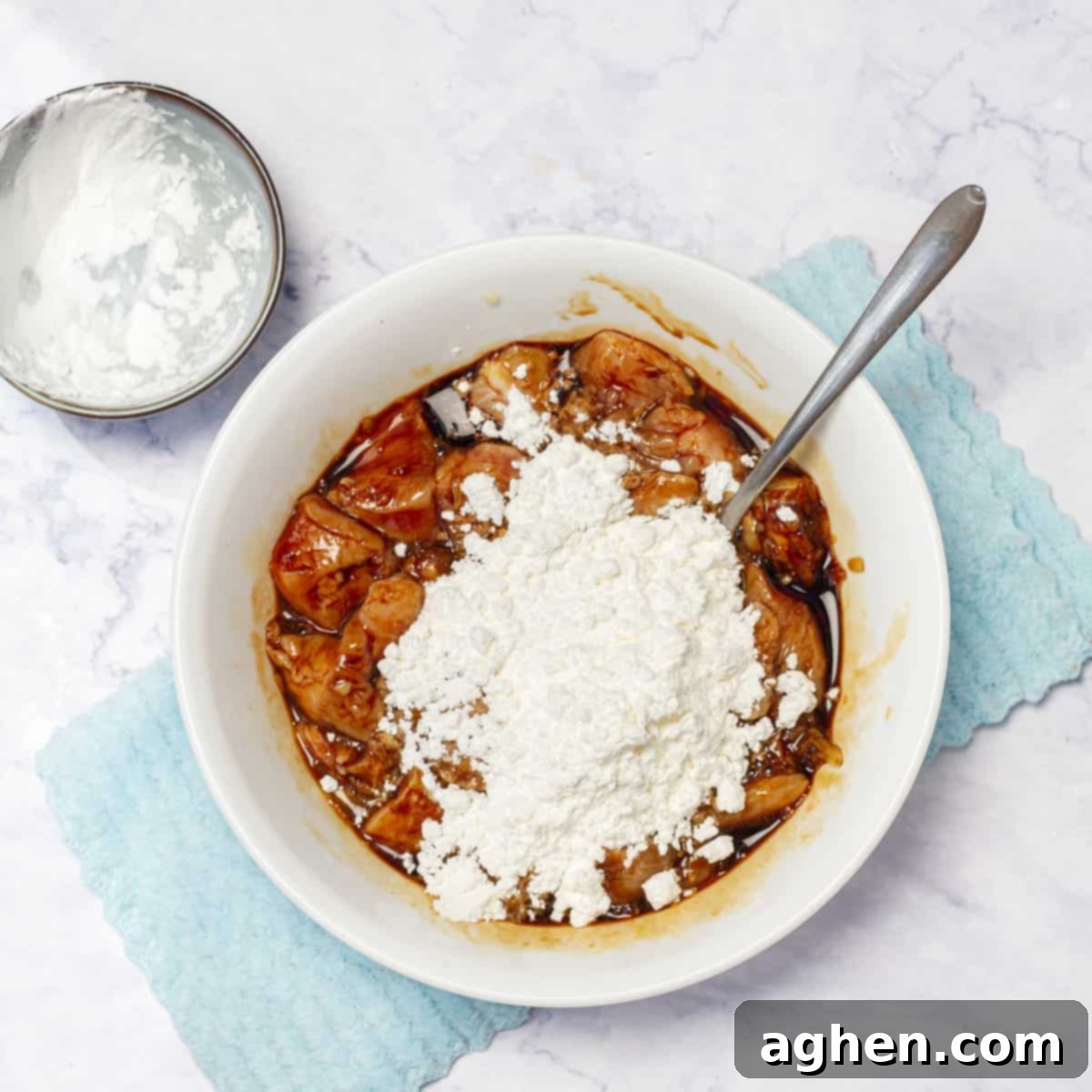 Lightened-Up Weight Watchers Orange Chicken 5 Dredging marinated chicken pieces in flour for a crispy coating.