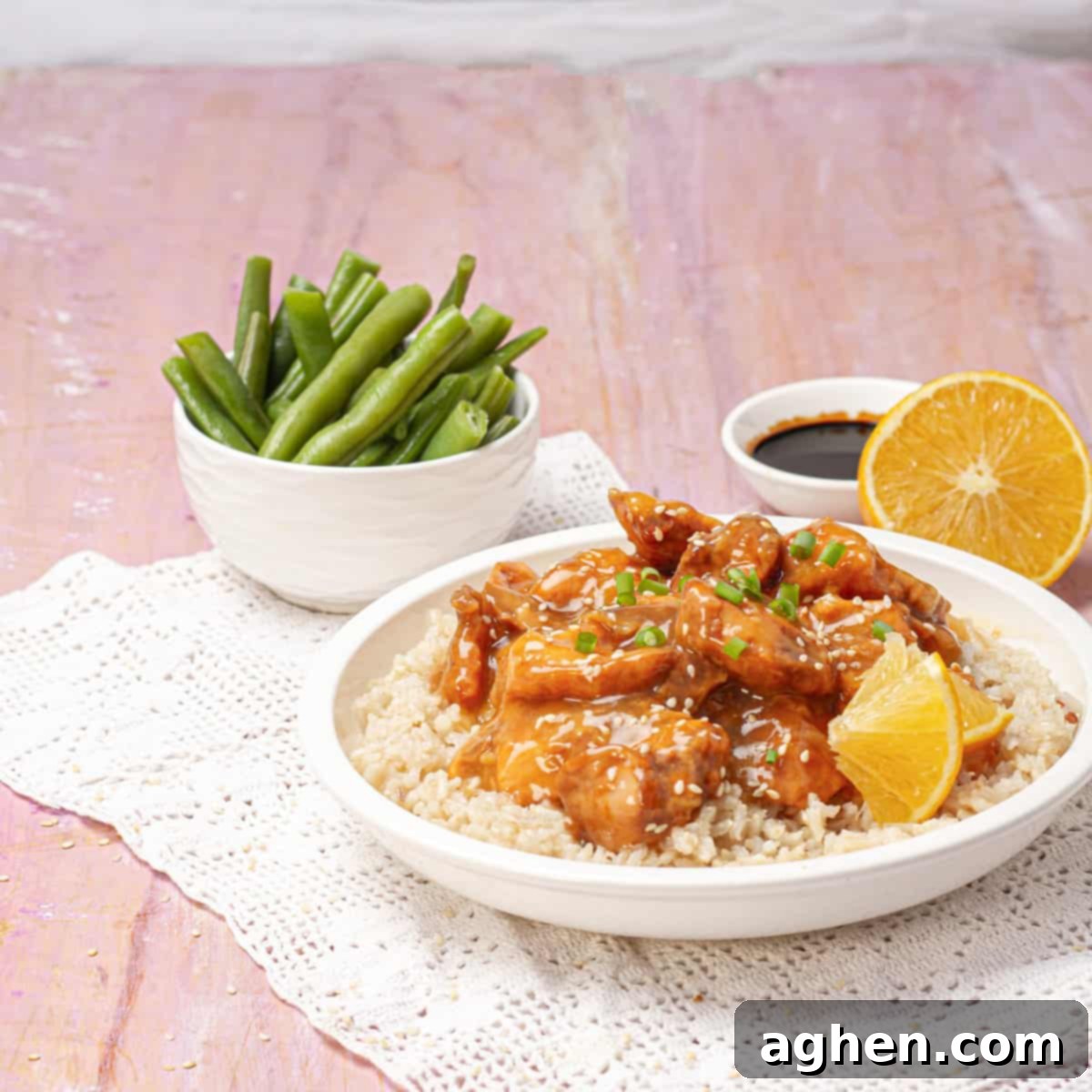 Lightened-Up Weight Watchers Orange Chicken 8 Baked orange chicken beautifully coated in sauce, ready to be served.