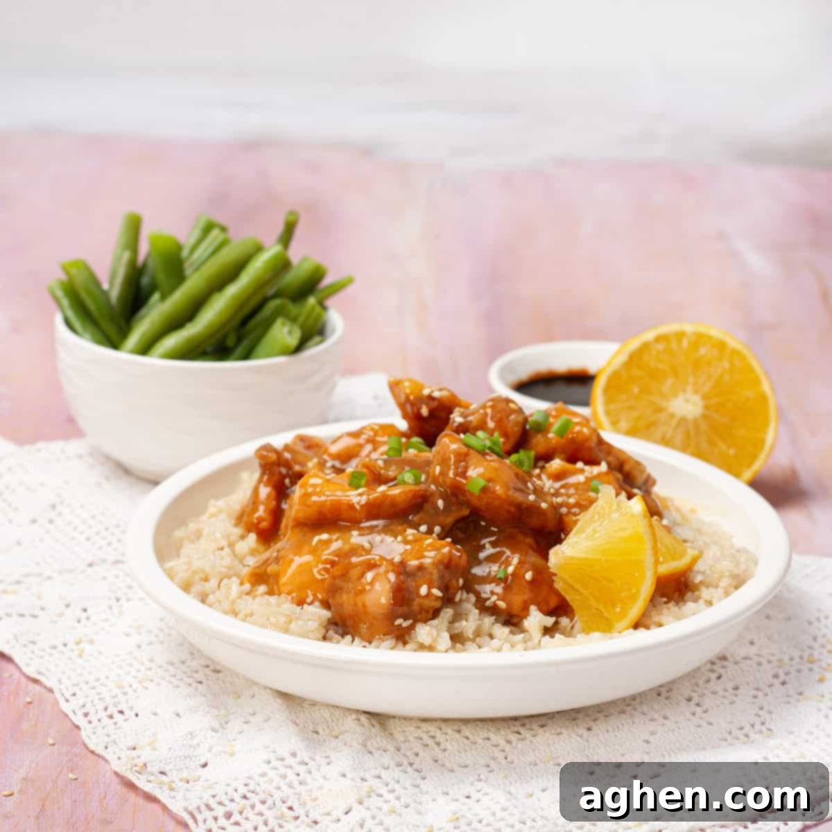 Lightened-Up Weight Watchers Orange Chicken 9 A close-up of healthy orange chicken, garnished and ready to be served.