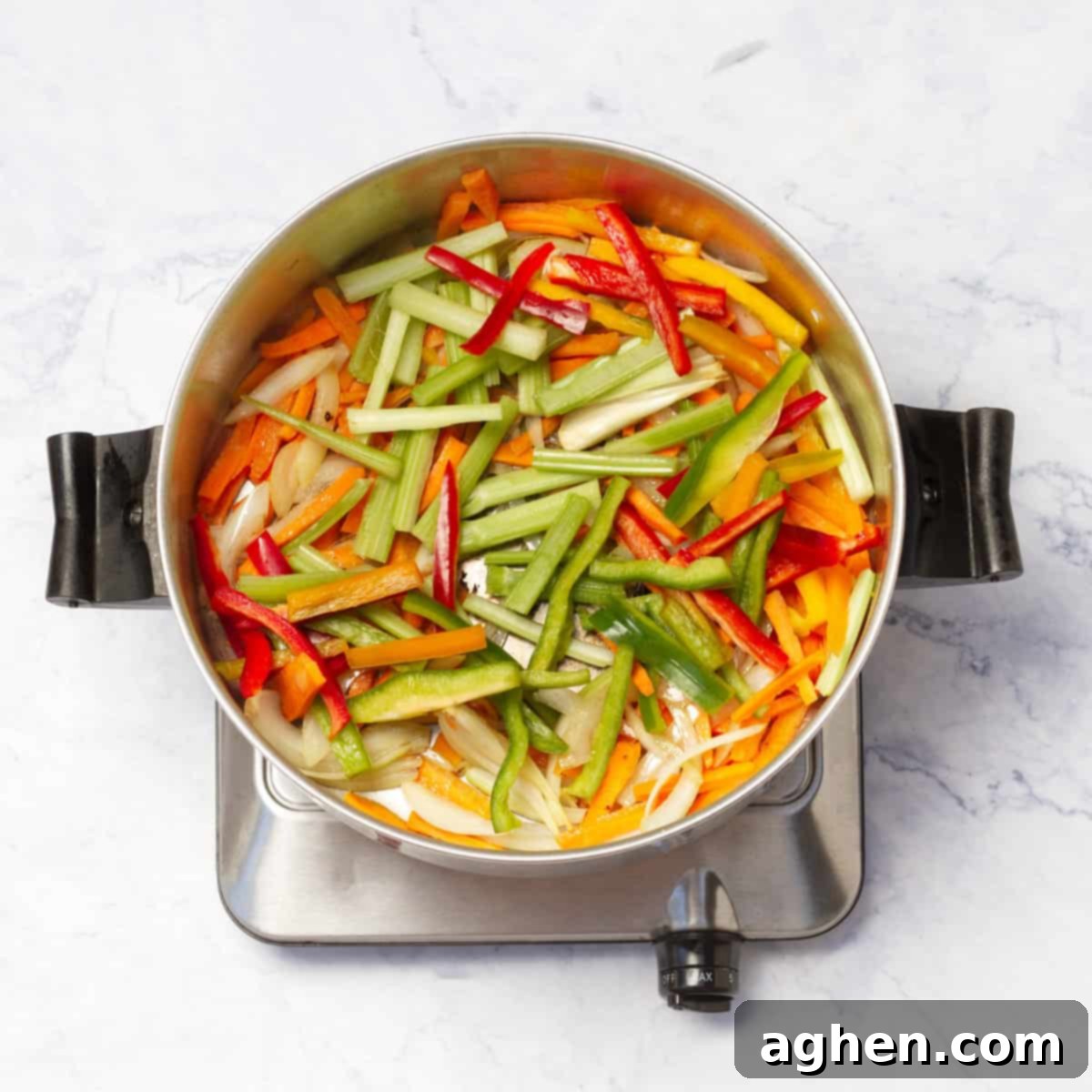 Shrimp Garden Medley 6 Onions, carrots, bell peppers, and celery stir-frying in a hot skillet, becoming tender-crisp.