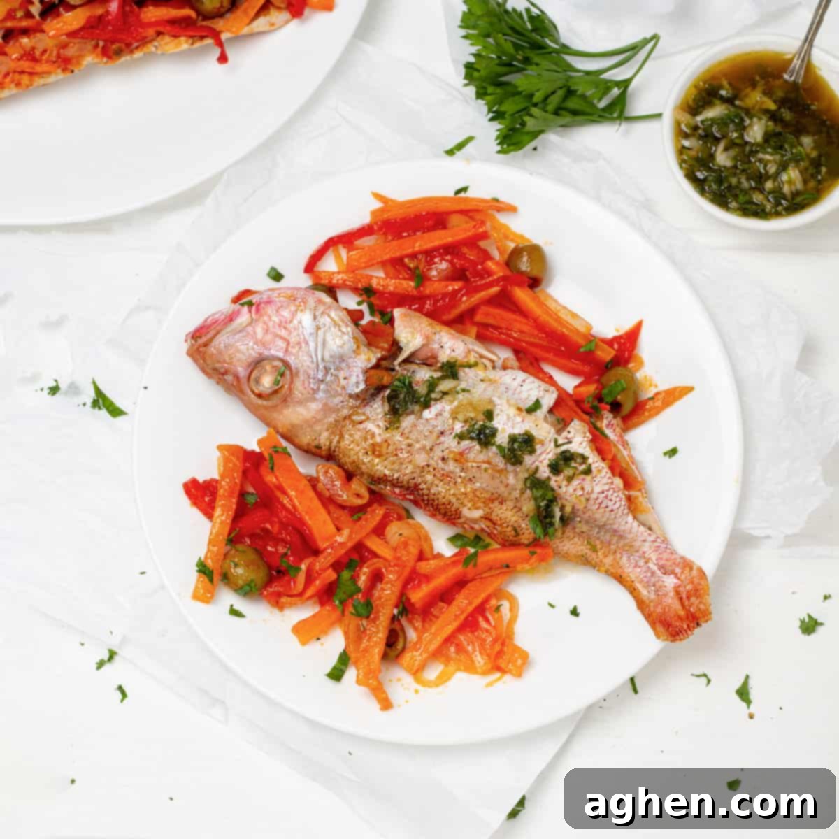 Mastering Mouthwatering Stuffed Fish 2 Stuffed Fish served with carrot salad and fresh herbs