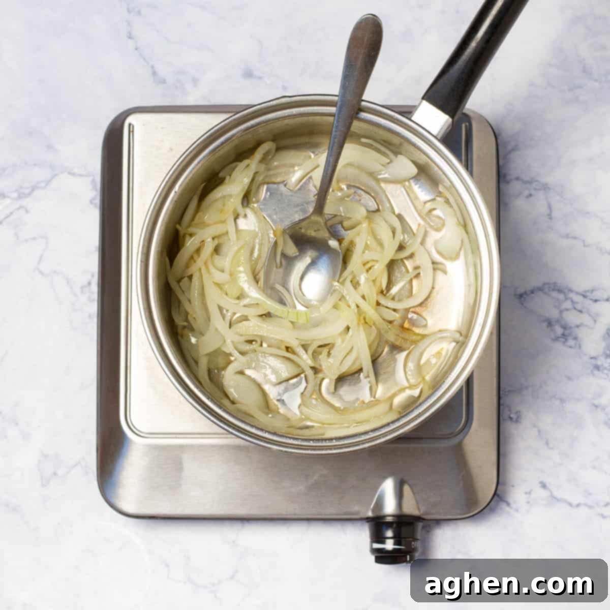 Mastering Mouthwatering Stuffed Fish 5 Sliced onion frying in a skillet with olive oil