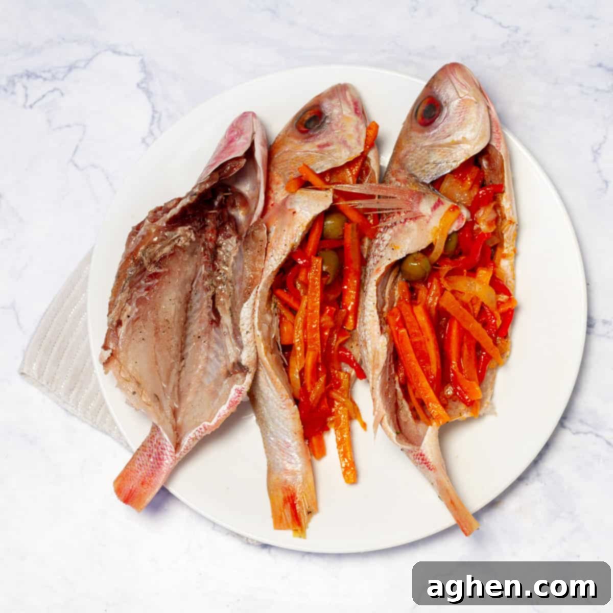 Mastering Mouthwatering Stuffed Fish 8 A perfectly cooked stuffed fish resting on a plate