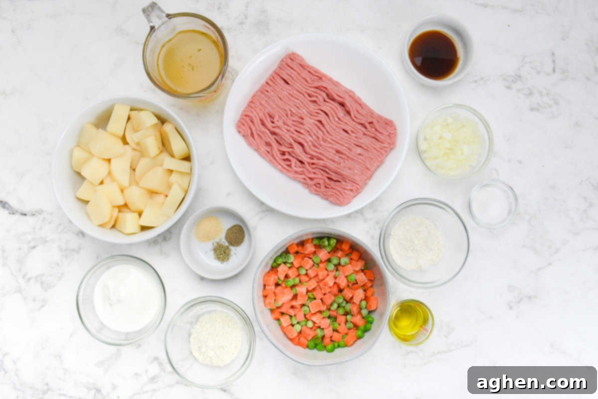 Weight Watchers' Timeless Ground Turkey Shepherd's Pie 3 All of the recipe ingredients in various sized bowls on a marble white background