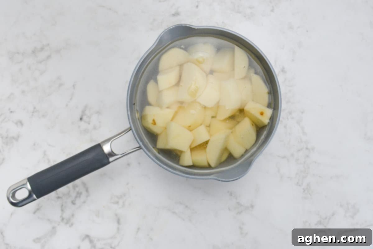Weight Watchers' Timeless Ground Turkey Shepherd's Pie 4 A small saucepan filled with salt, water, and potatoes